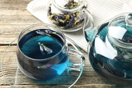 Delicious butterfly pea flower tea on wooden table, closeupの写真素材