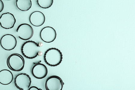 Stylish accessories on light blue background, flat lay. Space for textの写真素材