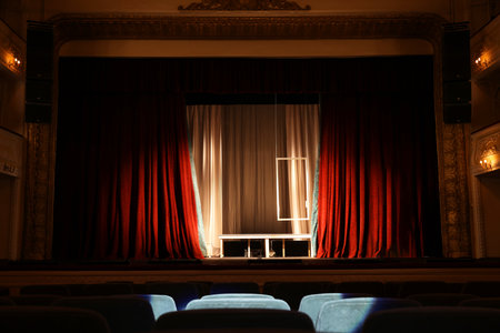Theater interior with stage and rows of comfortable seats