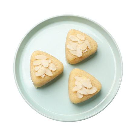 Pieces of semolina halva with almond flakes isolated on white, top viewの写真素材