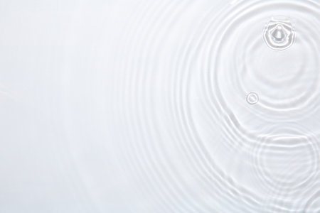 Rippled surface of clear water on white background, top viewの写真素材