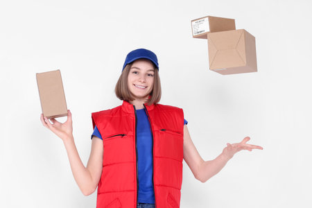 Happy postwoman with parcels on white backgroundの写真素材