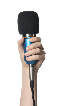 Hand holding microphone on white background, closeupの写真素材