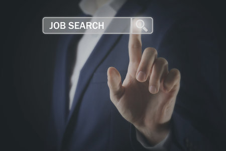 Job search. Businessman touching virtual search bar on black background, closeupの写真素材