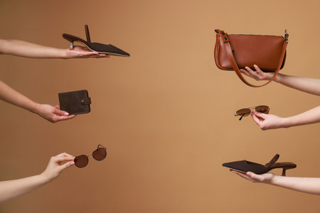 Women with stylish accessories and shoes on brown background, closeup. Space for textの写真素材