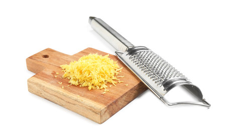 Fresh lemon zest and grater isolated on whiteの写真素材