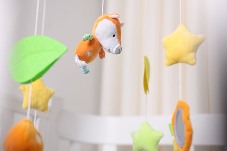 Cute baby crib mobile in child's room, closeupの写真素材