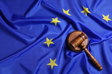 Judge's gavel on flag of European Union, top view. Space for text