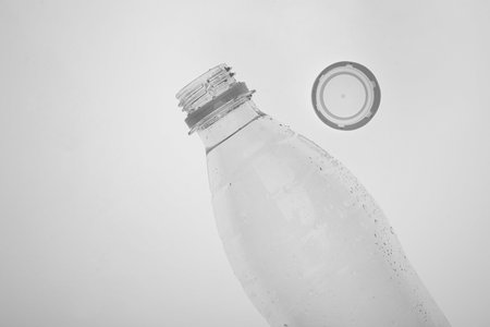 Empty plastic bottle on white background, top view