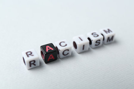 Word Racism made with beads on light grey background, closeupの写真素材