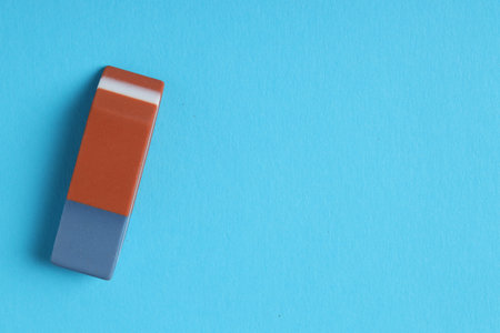 One eraser on light blue background, top view. Space for textの写真素材