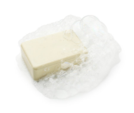 Bar soap with foam on white backgroundの写真素材