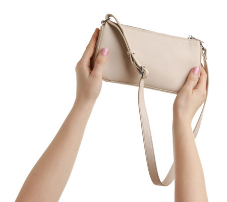 Woman with beautiful handbag on white background, closeup. Stylish accessoryの写真素材