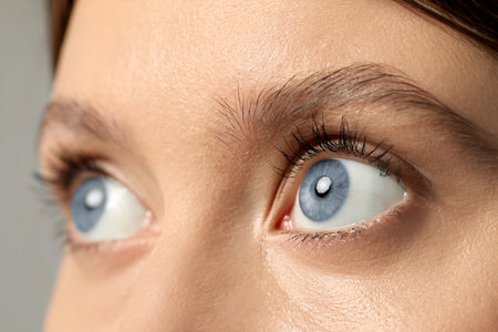 Closeup view of woman with blue eyesの写真素材