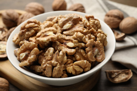 Peeled walnuts in bowl on table, closeupの写真素材