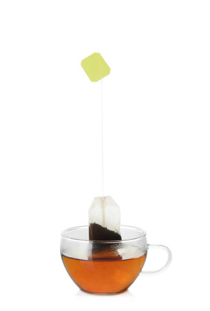 Cup with tea bag isolated on whiteの写真素材
