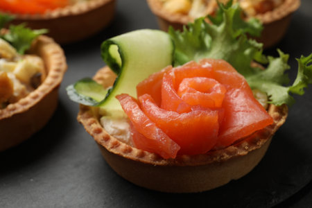 Tartlets with delicious filling on black table, closeupの写真素材