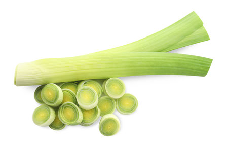 Whole and cut leeks isolated on white, top view