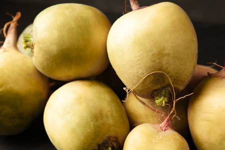 Whole fresh ripe turnips on table, closeup