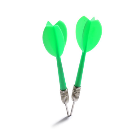 Green dart arrows isolated on white. Sports equipmentの写真素材