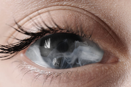 Hypnosis. Hypnotic smoke in woman's eye, closeupの写真素材