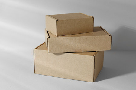 Blank cardboard boxes on white background. Mockup for design