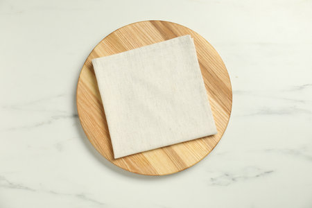 Light napkin and wooden board, top viewの写真素材