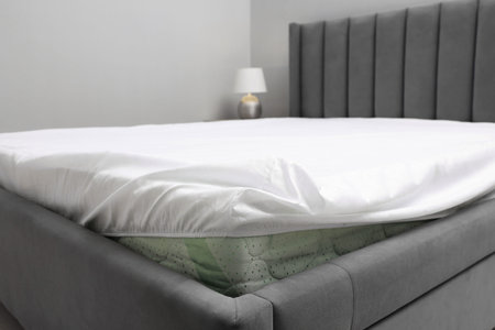 Bed with white clean lines at home, closeupの写真素材