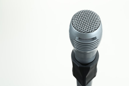 Stand with microphone on white background, closeup. Space for textの写真素材