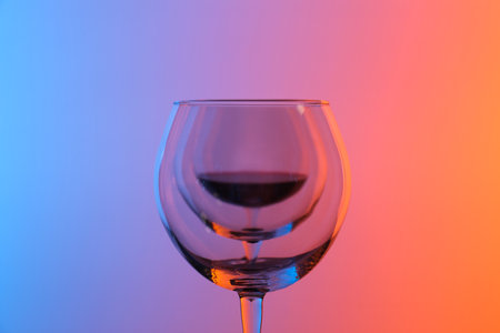 Wine glasses on color background, closeup viewの写真素材