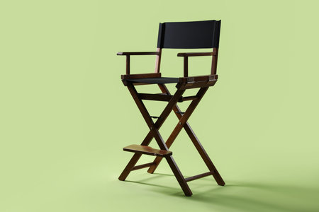 One empty director's chair on pale olive backgroundの写真素材