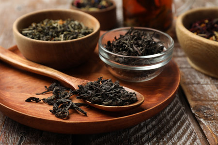 Different types of tea brew on wooden table, closeupの写真素材