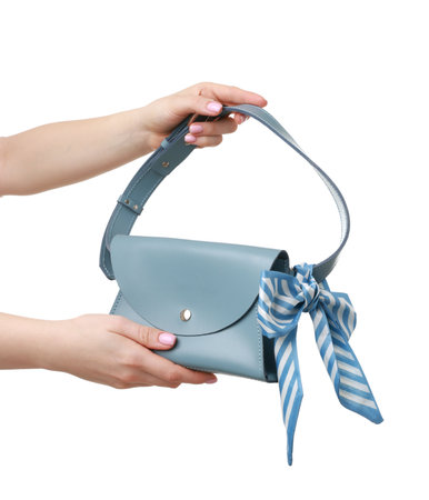 Woman with beautiful handbag on white background, closeup. Stylish accessoryの写真素材