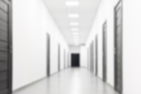 Blurred view of empty corridor with doors