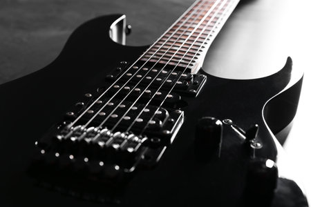 Modern electric guitar on black background, closeupの写真素材