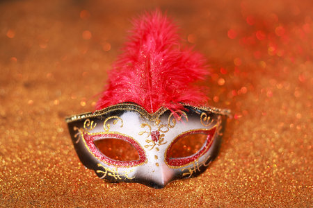 Beautiful carnival mask on shiny color background, closeupの写真素材