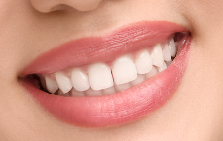 Young woman with healthy teeth and beautiful smile, closeupの写真素材