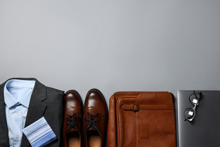Elegant men's outfit. Stylish clothes, accessories and shoes on grey background, flat lay. Space for textの写真素材