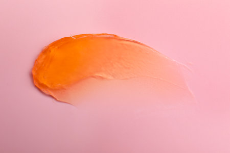 Sample of cosmetic product on pink background, top viewの写真素材