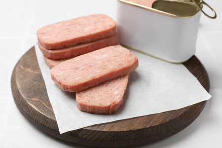 Tasty canned meat on white table, closeup