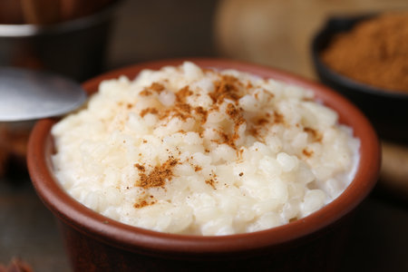 Tasty rice pudding with cinnamon on table, closeupの写真素材
