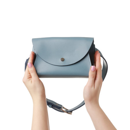 Woman with beautiful handbag on white background, closeup. Stylish accessoryの写真素材