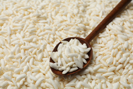 Spoon with puffed rice as background, closeupの写真素材