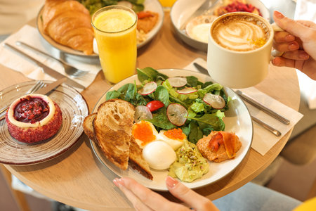 Woman having tasty breakfast in cafe, closeupのeditorial素材