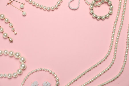 Frame made of many stylish jewelry and accessories on pink background, flat lay. Space for textの写真素材
