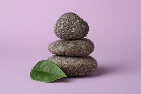 Stack of rocks on lilac background. Harmony and life balanceの写真素材