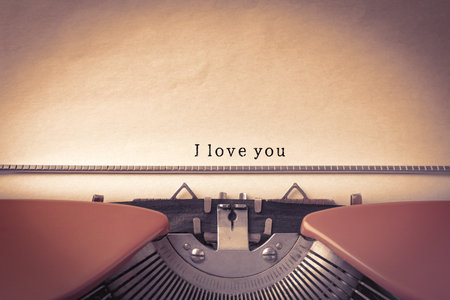 Typewriter with sheet of paper, closeup. Typed text I Love Youの写真素材