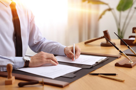Notary working at table in office, closeup