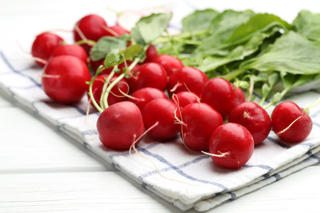 Many fresh radishes on white wooden table, closeupの写真素材