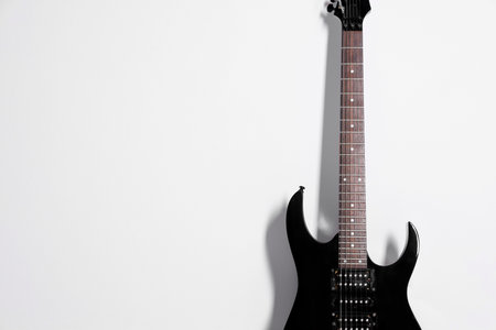 One modern electric guitar on white background.
